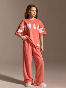 مجموعة رياضية كاجوال للفتيات المراهقات، تي شيرت فضفاض بياقة مستديرة مقترن مع بنطلون بقصة مريحة، لون برتقالي-وردي نابض بالحيوية الشبابية، قماش ناعم ولطيف على البشرة، مناسب للارتداء اليومي الكاجوال، المدرسة، والعطلات - البرتقالي مرهق - مشاهدة 5