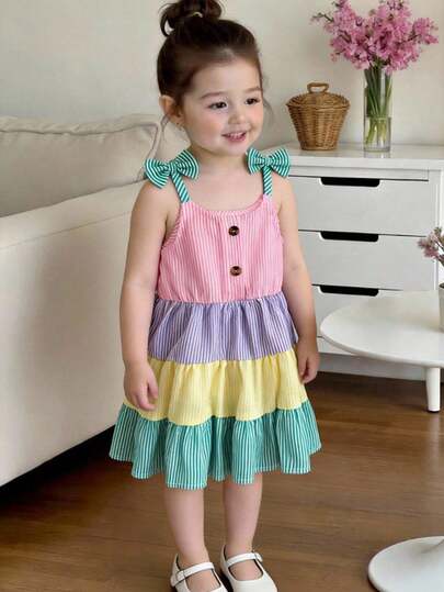 SHEIN Playful Pals Girls' Summer Vacation Striped Patchwork Spaghetti Strap Dress With Bow, Textured Fabric, Waist Cinched, Tiered Skirt, Suitable For Parties, Beach Outings