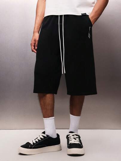 PLAYBOY X SUMWON Men's Knee Length Loose Fit Jersey Shorts With Drawstring Waist And Side Pockets For Casual Summer Wear