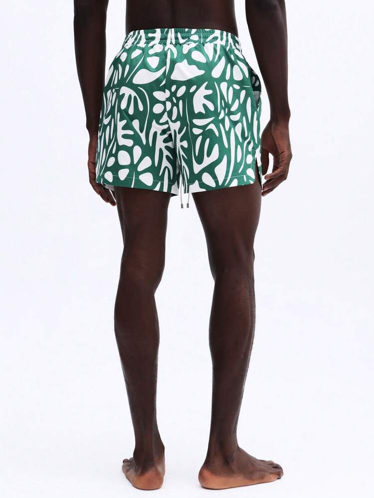 Calções de praia com estampa de folhas tropicais