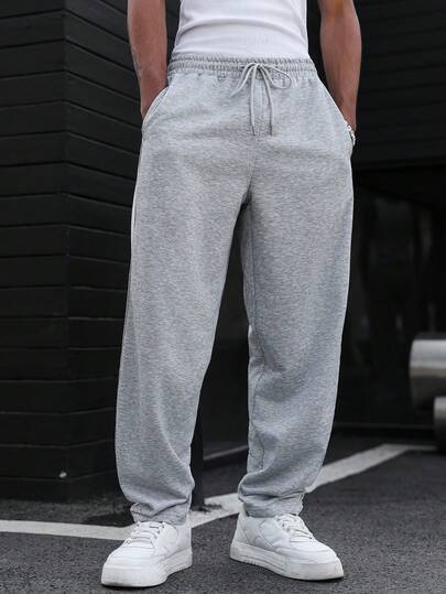 Manfinity Homme 休闲灰色男士运动裤，饰有滚边和毛边裤脚