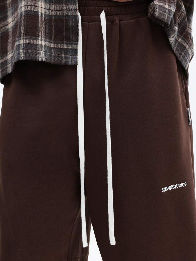 Spodenki dresowe ze ściągaczem i logo