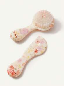 Cozy Pixies 两件套婴儿护理工具，包括梳子和花朵造型发刷，可轻柔梳理头发，也可用于婴儿洗澡。 - 彩色 - 查看 9