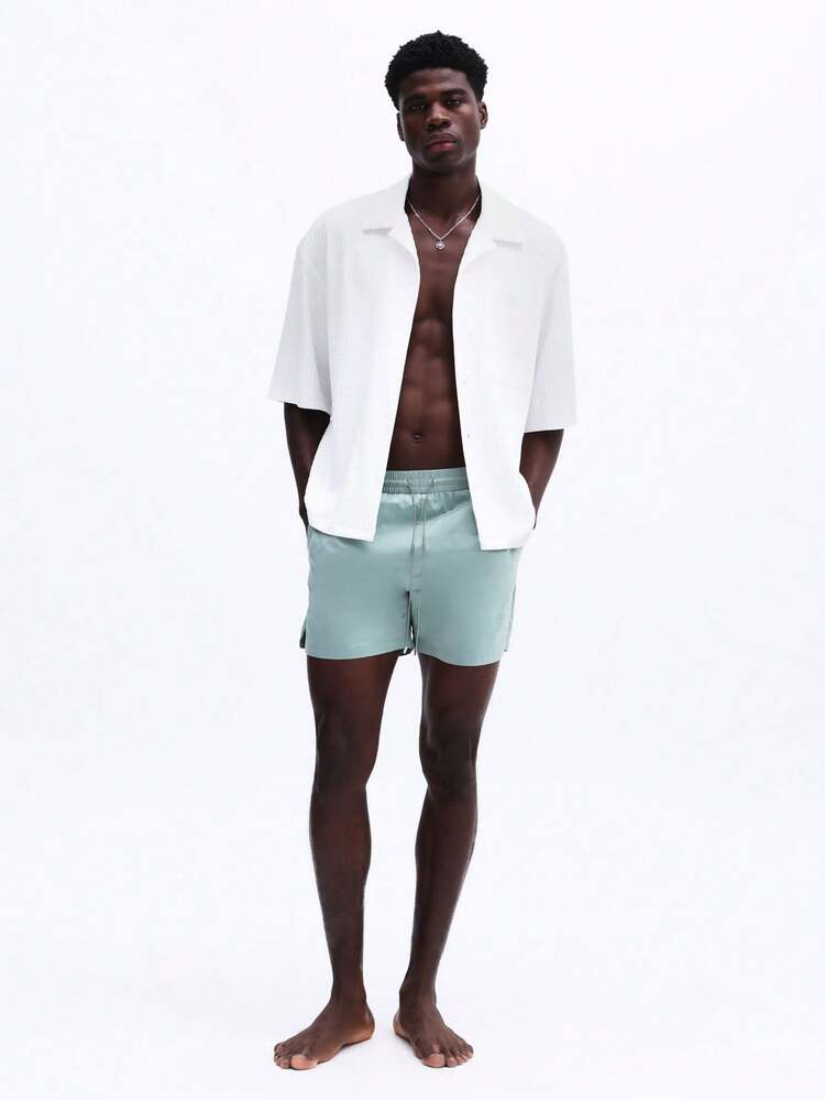 Badeshorts mit elastischem Bund und gesticktem Logo