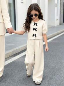 Firerie Kids 两件套女童蝴蝶结装饰泡泡袖上衣+宽松裤套装，休闲可爱时尚，适合外出、拍照、公园、露营、日常、派对、度假等场合。 - 白色 - 查看 1