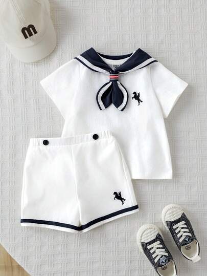 SHEIN Set de 3 piezas Unisex para bebé niño/niña, estilo marinero, que incluye: Camiseta de manga corta blanca, Top de punto, Pantalones/Shorts blancos y Capa azul marino. Elegante para fiestas, bodas, bautizos y baby showers.
