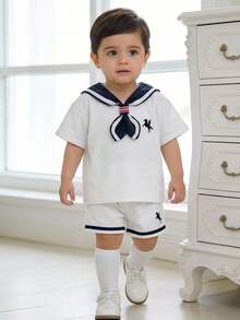 SHEIN 3pcs/Set Unisex Baby Boy Sailor Style Outfit,White Summer Knit Top,Shorts & Navy Blue Cape Set,Elegant Page Boy Clothes For Wedding Christening Gift - White - View 3