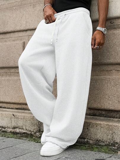 Manfinity EMRG Pantalon de survêtement décontracté pour hommes, taille à cordon de serrage, poches, coupe ample, gris. Pantalon de survêtement ample, gris, pantalon de jogging homme Pro Club, pantalon long, pantalon de survêtement homme, pantalon ample gris, pantalon ample, pantalon de jogging