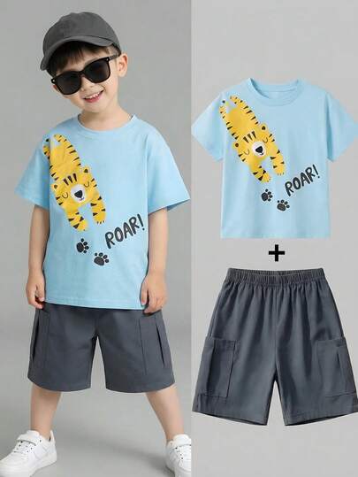 SHEIN Conjunto de 12 piezas de top de manga corta con cuello redondo y decoración de estampado animal + pantalones cortos de cintura elástica de unicolor con decoración de bolsillo para niños pequeños