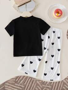 SHEIN Playful Pals 女童休闲时尚T恤上衣，蝴蝶结拼接设计，搭配喇叭裤，显腿长显高，夏季新款女童T恤套装，休闲运动装，心形印花裤套装 - 黑色 - 查看 2