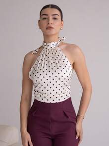 Andrea Bello Beige And Black Polka Dot Satin Tie-Neck Top With High Collar And Open Back – Vintage Elegant Court Style, Date, Party, Y2K, Festive & Birthday Wear Polka Dot Top Tie Tops White Polka Dot Top Polkadot Top Halter Neck Top,Halloween Costumes,Vacation Outfits Women,2000s Clothes - Apricot - View 1