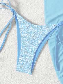 Swim Mod Bộ 3 món đồ bơi mùa hè đi biển, chất liệu vải họa tiết hoa, trang trí hoa vàng, gồm áo yếm buộc dây bên hông và quần bơi buộc dây bên hông, cùng chân váy lưới màu trơn. - Màu xanh nhạt - Xem 4