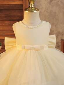 SHEIN Glamorique Kids 女婴杏色网纱蓬蓬裙，无袖方领，带大蝴蝶结装饰，适合派对穿着。休闲修身短款公主裙，杏色无袖蓬蓬裙，带蝴蝶结，适合花童跳舞，蝴蝶结，女婴杏色裙摆，双层网纱连衣裙，白色珍珠使人自信骄傲，连衣裙，钢琴演奏，蓬蓬裙，舞会礼服，夏季，春季婴儿蓬蓬裙，香槟色婴儿连衣裙，象牙色婴儿连衣裙，女婴连衣裙，优雅婚礼女婴蝴蝶结连衣裙 - 杏色 - 查看 4
