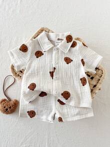 SHEIN Bộ 2 áo liền quần ngắn tay cổ tròn cho bé trai sơ sinh, họa tiết tre, sọc trơn, thêu hình gấu dễ thương, kiểu dáng retro, cài khuy, thích hợp cho các hoạt động ngoài trời hoặc công viên mùa hè. - trắng - Xem 8