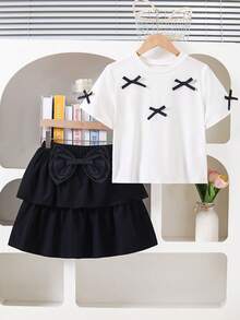 Elladie kids 女童可爱优雅校服连衣裙；黑白舒适短袖蛋糕裙，饰有3D蝴蝶结。白色蝴蝶结上衣搭配双层裙摆，适合日常或度假穿着。 - 黑色 - 查看 6