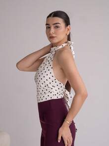 Andrea Bello Beige And Black Polka Dot Satin Tie-Neck Top With High Collar And Open Back – Vintage Elegant Court Style, Date, Party, Y2K, Festive & Birthday Wear Polka Dot Top Tie Tops White Polka Dot Top Polkadot Top Halter Neck Top,Halloween Costumes,Vacation Outfits Women,2000s Clothes - Apricot - View 4