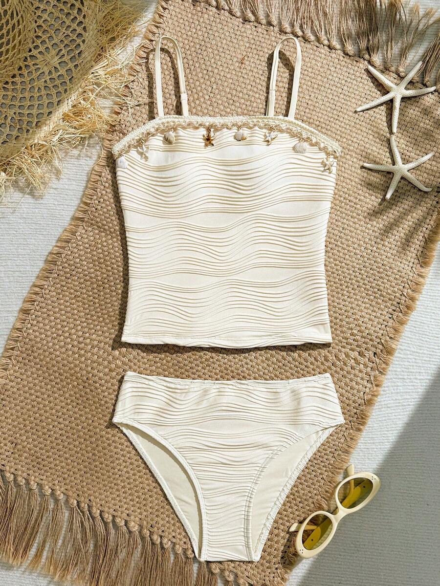 SHEIN Bộ đồ bơi Tankini cho bé gái tuổi teen, gồm áo hai dây và quần tam giác, chất liệu vải có họa tiết, thích hợp cho bãi biển, hồ bơi, kỳ nghỉ thư giãn, mùa xuân/hè. Bộ Tankini cạp cao cho bé gái 7-9 tuổi, đồ bơi hai mảnh họa tiết vỏ sò, đồ bơi mùa hè có họa tiết, Tankini hình sao biển, đồ bơi tuổi teen, đồ bơi hai mảnh mùa hè, đồ bơi kín đáo, bộ Tankini cạp cao cho tuổi teen, bộ đồ đi biển màu trắng cho bé gái. - Màu be - Xem 1