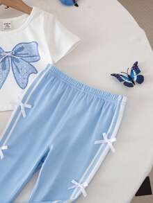 SHEIN Conjunto de camiseta de manga corta con estampado de lazo y pantalones acampanados de cintura elástica, estilo lindo y veraniego para bebé niña - Azul - Ver 6