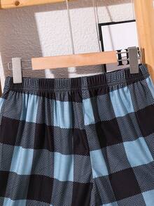 SHEIN Bộ đồ ngủ mùa hè 2 món cho bé trai tuổi teen, gồm áo thun trơn rộng rãi và quần short kẻ caro, chất liệu dệt kim. - Nhiều màu - Xem 8
