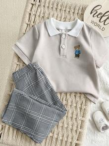 SHEIN Bộ đồ thường ngày cho bé trai gồm áo polo tay ngắn in hình hoạt hình và quần dài. - trắng - Xem 4