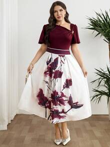 Modelyn Bộ đồ 2 món thanh lịch dành cho nữ cỡ lớn, màu trơn, trang trí kim loại, cổ áo bất đối xứng, tay ngắn và chân váy midi in hoa. - Nhiều màu - Xem 6