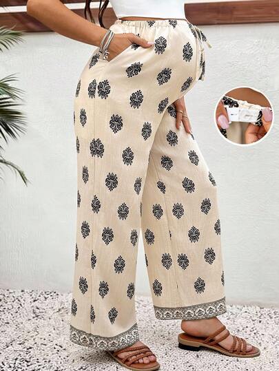 SHEIN Quần bầu ống rộng dáng suông in hoa, cạp chun điều chỉnh được, thích hợp mặc thường ngày.