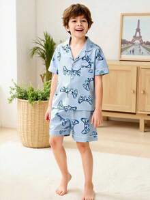 Bộ 2 món đồ mặc thường ngày thoải mái cho bé trai tuổi thiếu niên, gồm áo polo ngắn tay in hình tay cầm chơi game tối giản và quần short cùng màu. - Nhiều màu - Xem 4