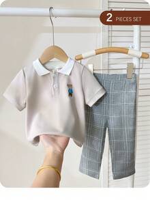 SHEIN Bộ đồ thường ngày cho bé trai gồm áo polo tay ngắn in hình hoạt hình và quần dài. - trắng - Xem 9