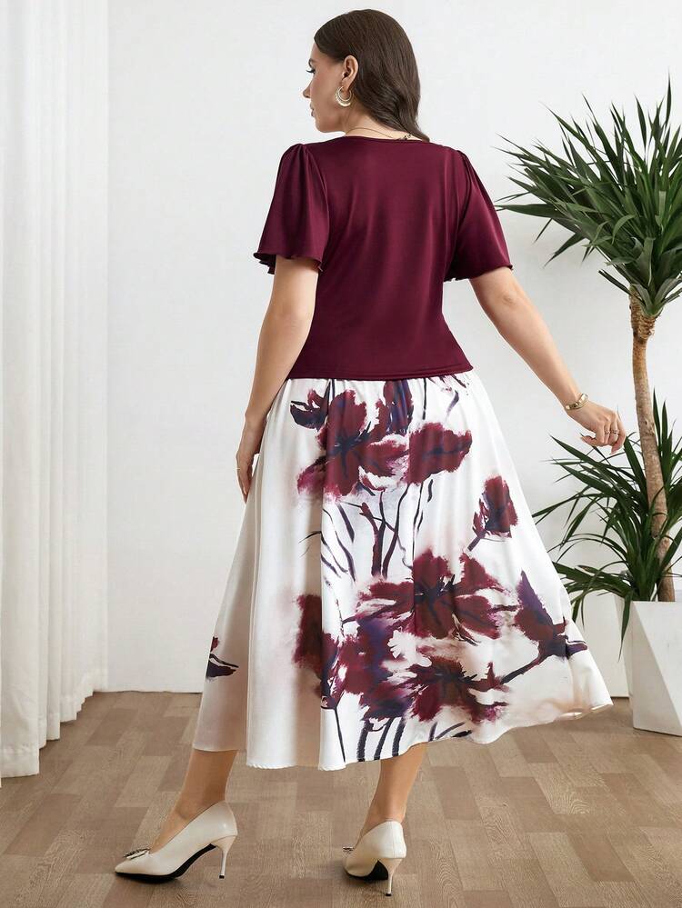 Modelyn Bộ đồ 2 món thanh lịch dành cho nữ cỡ lớn, màu trơn, trang trí kim loại, cổ áo bất đối xứng, tay ngắn và chân váy midi in hoa. - Nhiều màu - Xem 2