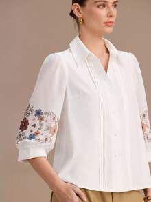 Uhlyne 新款女装系列：优雅性感，完美适用于办公室、度假、海滩、通勤、浪漫约会、宴会、派对、生日派对、音乐会、情人节和嘉年华等场合。女士春夏新款：七分袖印花衬衫，宽松条纹领，白色衬衫。适合女性通勤、外出、休闲穿着，以及夏季和精致时尚的穿搭风格。 - 白色 - 查看 3