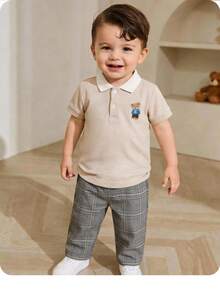 SHEIN Bộ đồ thường ngày cho bé trai gồm áo polo tay ngắn in hình hoạt hình và quần dài. - trắng - Xem 1