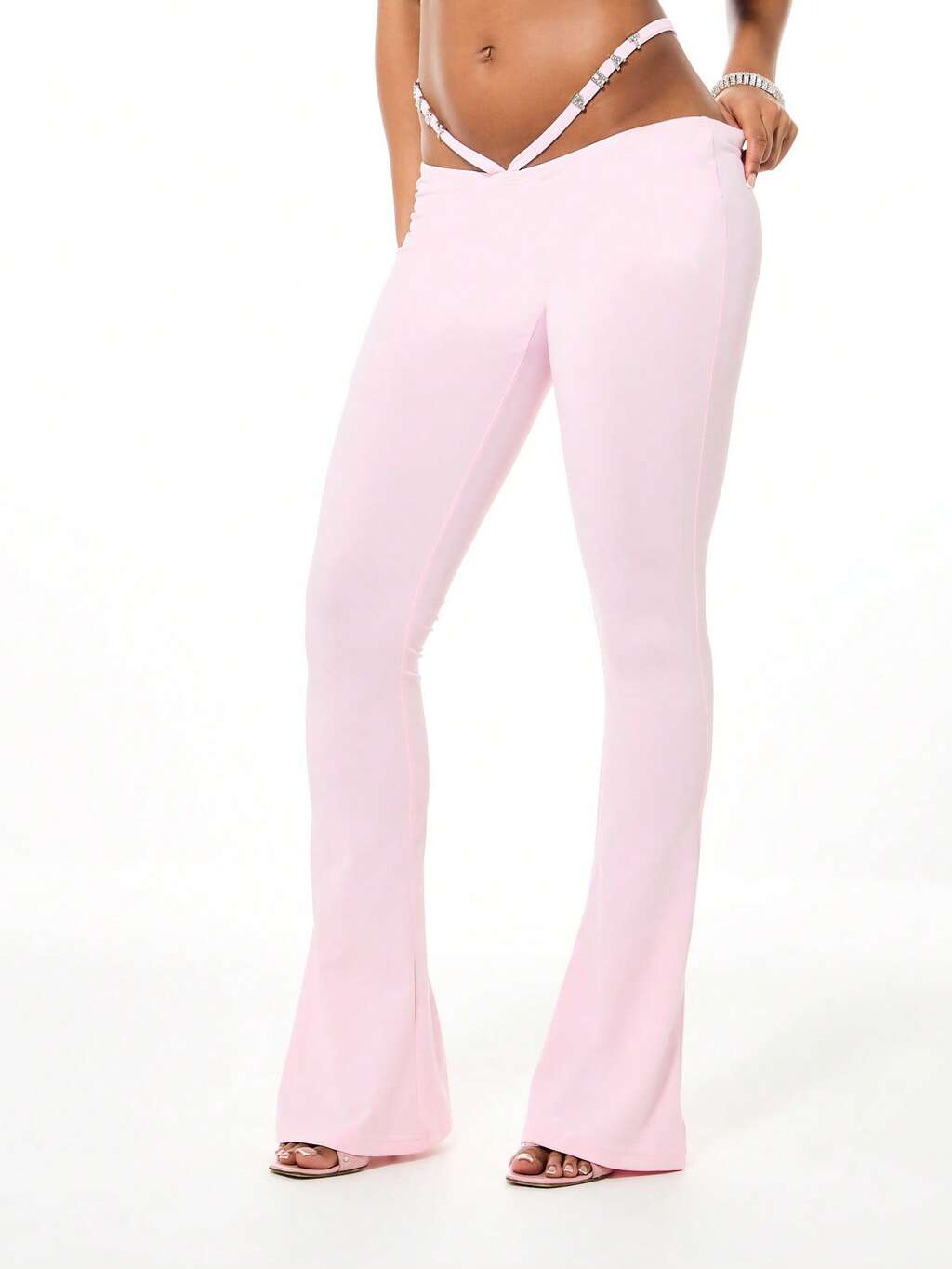 BABYPHAT Leggings évasés à taille haute avec détail de laçage au dos. Pantalon style pattes d'éléphant en tissu extensible.
