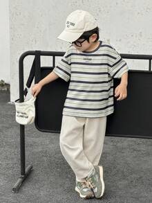 Bộ 2 món gồm áo thun thể thao và quần dài trắng cổ tròn kẻ sọc kiểu Nhật Bản và Hàn Quốc dành cho bé trai, thích hợp cho sinh nhật, tiệc tối, biểu diễn, đám cưới, lễ rửa tội, lễ khai giảng. Phù hợp cho sử dụng hàng ngày, đi học, du lịch, thể thao, mùa xuân và mùa hè. - Màu be - Xem 3