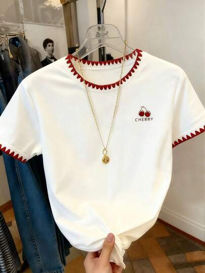 SHEIN 1pc Tween Girl  Cherry Shirts White Cherry T-Shirt,This Is A Short-Sleeved Casual T-Shirt With A Sweet Cherry Print And Delicate Real Embroidery On The Cuffs And Collar. The Loose Fit Is Cute And Versatile, Making It Perfect For Spring And Summer.