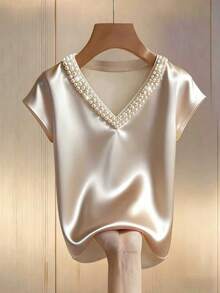 Franclia Blusa de satén con escote en V color albaricoque, con aplicaciones de perlas y mangas cortas, para mujer. Adecuada para uso casual, elegante, diario, trabajo de oficina o commute. Blusa de mujer elegante con perlas, blusas de satén para mujer, blusa de mujer elegante y clásica, blusas de seda para mujer - Champán - Ver 4