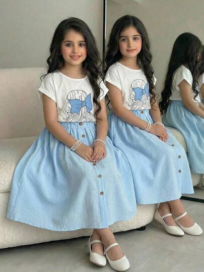 Girls Casual Loose Cartoon Girl Print Round Neck Raglan Sleeve White Knit T-Shirt And Pleated Ruffle Waist Button Decor Flared Woven Textured Skirt Set, Blue