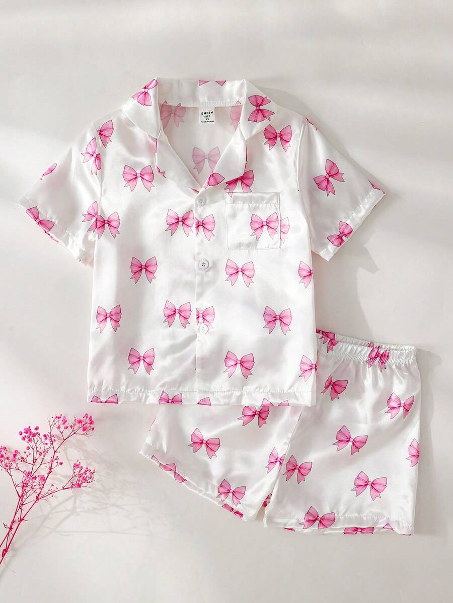 Bộ quần áo mặc nhà cho bé gái, gồm áo ngắn tay, cổ bẻ, in nơ màu hồng và quần short, chất liệu chống cháy. - Màu Hồng baby - Xem 1