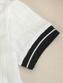 Souflis Souflis 男婴夏季经典 Polo 领套装，白色主体采用纹理提花面料，黑白罗纹饰边，刺绣马匹标志，宽松黑色短裤，两件套。 - 黑色 - 查看 6