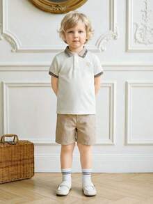 Souflis Souflis Ținută din 2 piese pentru băieți mici, include top cu guler polo și mânecă scurtă și pantaloni scurți asortați. Topul are design brodat, guler și manșete cu nervuri pentru un aspect rafinat. Pantalonii scurți din material texturat adaugă o senzație tactilă, perfecți pentru ieșirile de vară ale copiilor mici. - Multicolor - Vizualizare 3