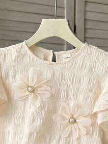 Souflis Souflis Young Girl Fashion Elegant 3D Floral Decor Solid Color Round Neck Ruffle Hem Loose Casual Blouse, Girls Flower Top - Apricot - View 5