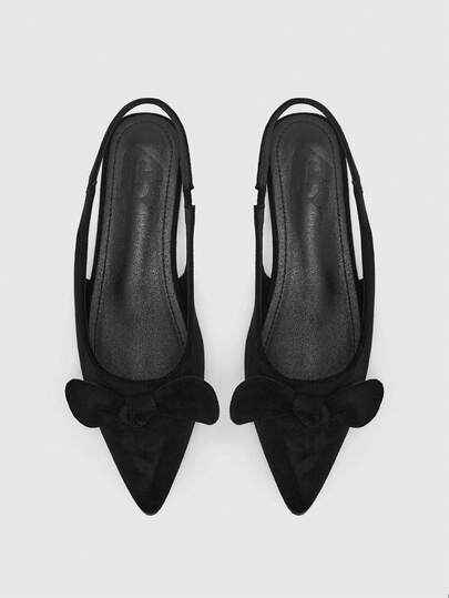 CUCCOO BIZCHIC Zapatos de mujer tipo mula plana, de ante negro con punta puntiaguda y correa para el tobillo, decoración de lazo, estilo de hada dulce y suave, suela blanda y cómoda para ir al trabajo