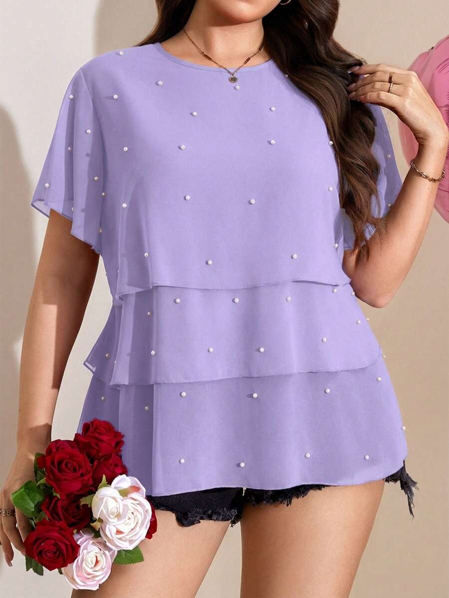 Comfylo 飘逸荷叶边下摆加大码女式短袖衬衫，优雅百搭，适合工作通勤、夏季、圣帕特里克节、复活节、春季、海滩、休闲场合等。女士休闲上衣和衬衫，高端女式上衣，最新款女式上衣，夏季女式上衣热销，休闲女式上衣，优雅新款衬衫，新款衬衫热销。 - 紫羅蘭色 - 查看 1