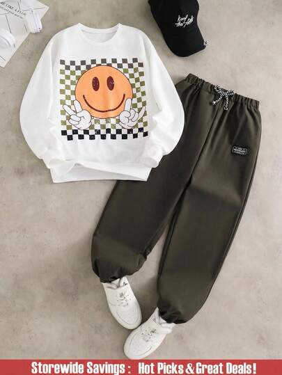 SHEIN Set de 2 piezas Conjunto de moda para niño preadolescente con sudadera blanca emparejada con pantalones verde oliva. La sudadera presenta una estampación gráfica verde, tela suave y cómoda, adecuada para uso en primavera/otoño, versátil para la escuela, salidas y talla grande.