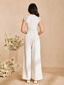 Bộ áo liền quần thanh lịch có khóa kéo và viền ren dành cho thiếu nữ. Chất liệu vải mềm mại, ống rộng, cạp cao, tay áo khoét lỗ, phù hợp cho các buổi đi chơi hàng ngày và tiệc tùng. - trắng - Xem 2