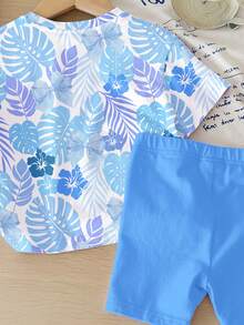 SHEIN Bộ đồ thể thao tối giản cho bé gái gồm áo thun tay ngắn cổ tròn dáng rộng và quần short bó sát, họa tiết thỏ xanh hoạt hình dễ thương, in hình nơ hoa nhiệt đới màu xanh ombre, thích hợp cho mùa xuân/hè. - Nhiều màu - Xem 6