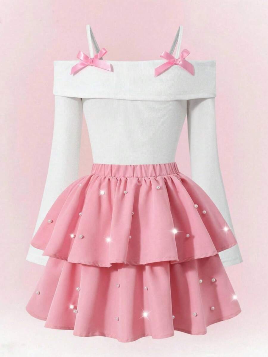 مجموعة تي شيرت أنيقة للفتيات المراهقات، توب مافي من الأبيض مع تنورة سوداء منسوجة بشكل كعكة، التوب مزين بفيونكة سوداء، التنورة مرصعة بالخرز - وردي - مشاهدة 1