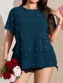 Comfylo 飘逸荷叶边下摆加大码女式短袖衬衫，优雅百搭，适合工作通勤、夏季、圣帕特里克节、复活节、春夏、海滩度假、休闲放松等场合。这款女式上衣饰有精美装饰，款式多样，包括串珠上衣、珍珠细节上衣、高级女式衬衫、夏季休闲上衣、优雅女式衬衫、最新款休闲女式衬衫等。 - 水鴨藍 - 查看 1