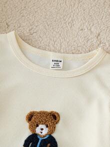 SHEIN Playful Pals 2件套婴儿幼儿男童休闲可爱卡通熊印花宽松短袖T恤和黑色短裤套装，适合日常穿着、户外玩耍、亲子活动、假日旅行。格子图案男童休闲短袖夏季套装，泰迪熊图案上衣，男童夏季套装，适合婚礼、迎婴派对、洗礼和一周岁生日庆祝等场合，也是送给宝宝的节日礼物。 - 白色 - 查看 5