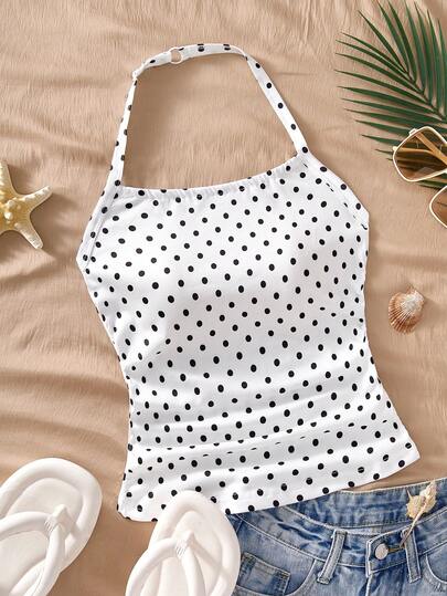 一件复古法式吊带背心，适合青少年和年轻女孩，经典黑白波点印花，无袖设计，修身剪裁，可单穿或叠穿，适合日常穿着、校园活动、休闲聚会，春夏秋季皆宜。