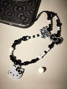 HELLO KITTY AND FRIENDS | SHEIN 可爱卡通珍珠闪亮黑白手机挂绳蝴蝶结手机链手机吊坠 - 黑與白 - 查看 2